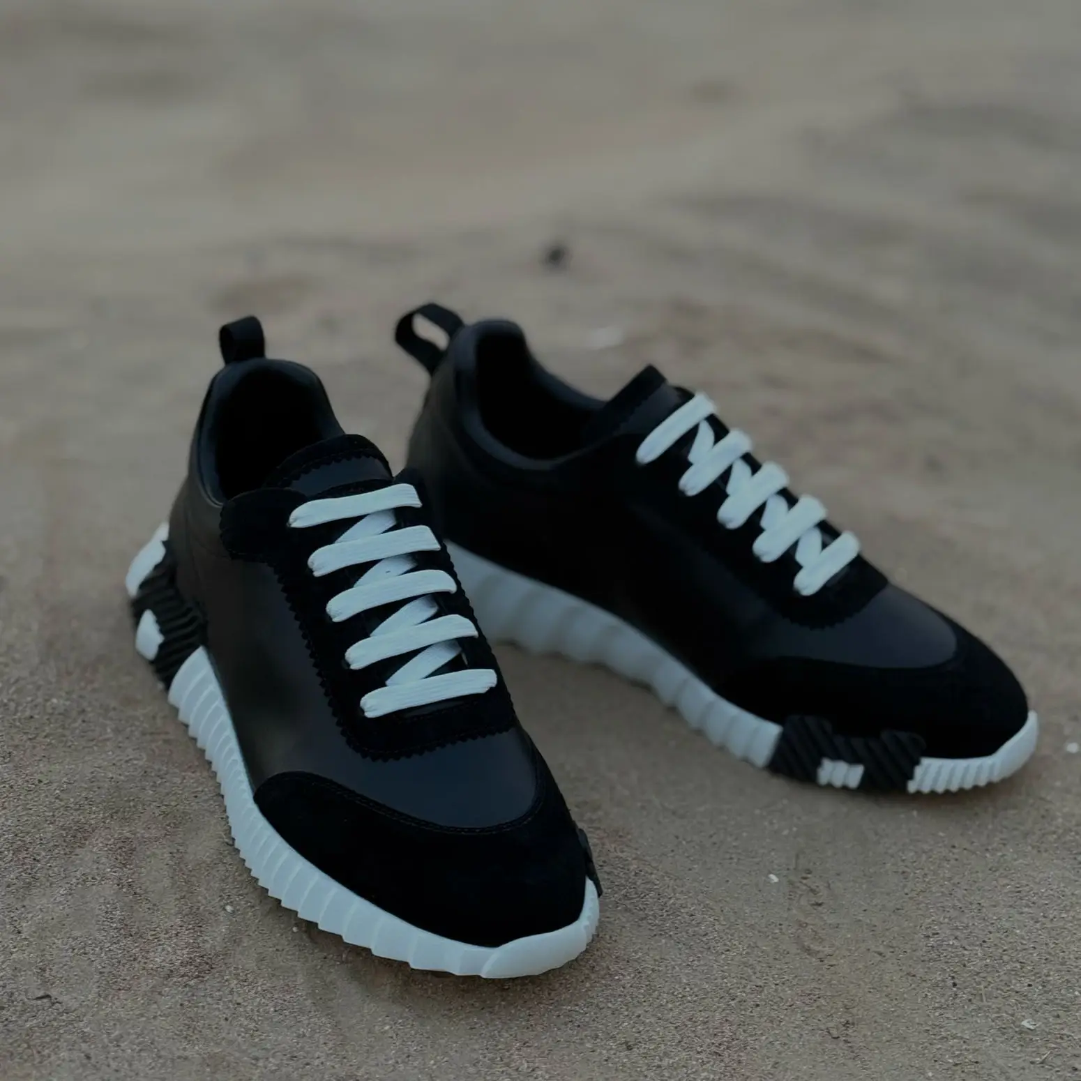 Hermès Bouncing Sneakers – Black Leather & Suede with White Laces and Sole in Dubai UAE Hermès Bouncing Sneakers – Black Leather & Suede with White Laces and Sole in Dubai UAE
