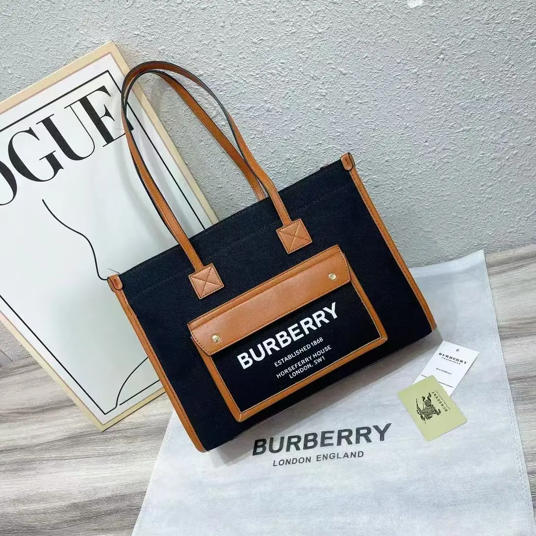 Burberry Horseferry London Tote Bag – Black Canvas & Brown Leather in Dubai UAE Burberry Horseferry London Tote Bag – Black Canvas & Brown Leather in Dubai UAE