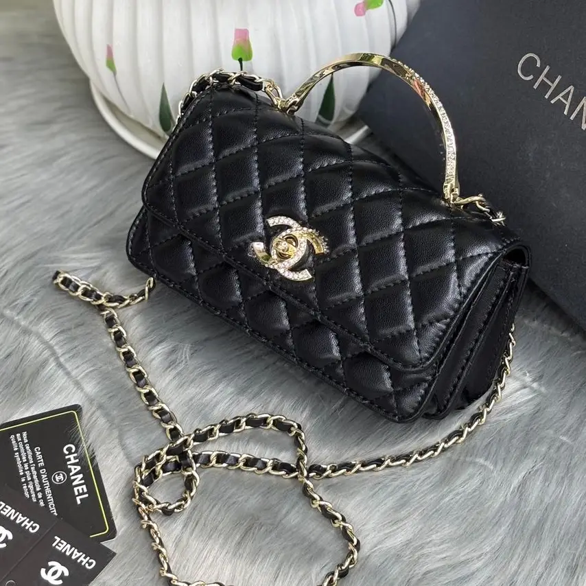 Chanel Black Quilted Calf Leather Shoulder Bag with Silver CC Logo and Chain Strap in Dubai UAE Chanel Black Quilted Calf Leather Shoulder Bag with Silver CC Logo and Chain Strap in Dubai UAE