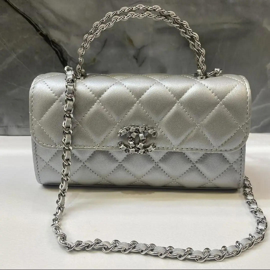 Chanel Silver Metallic Quilted Hobo Bag with Chain Strap and Signature Logo in Dubai UAE Chanel Silver Metallic Quilted Hobo Bag with Chain Strap and Signature Logo in Dubai UAE