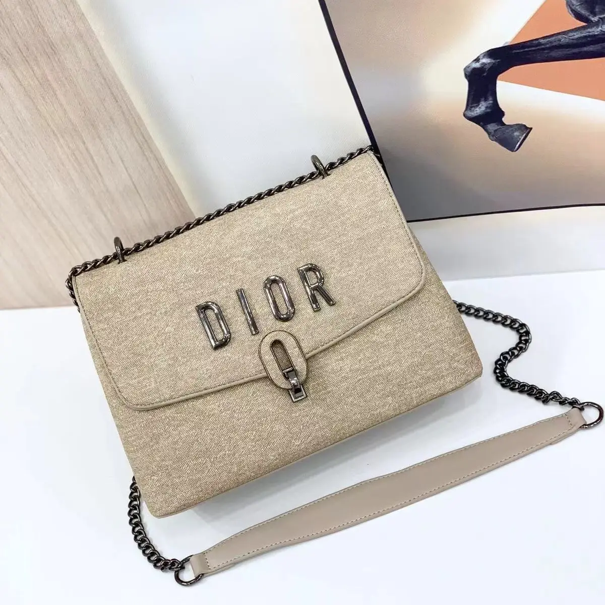 Dior Saddle Bag in Beige Canvas with Chain Strap – Iconic Designer Handbag in Dubai UAE Dior Saddle Bag in Beige Canvas with Chain Strap – Iconic Designer Handbag in Dubai UAE