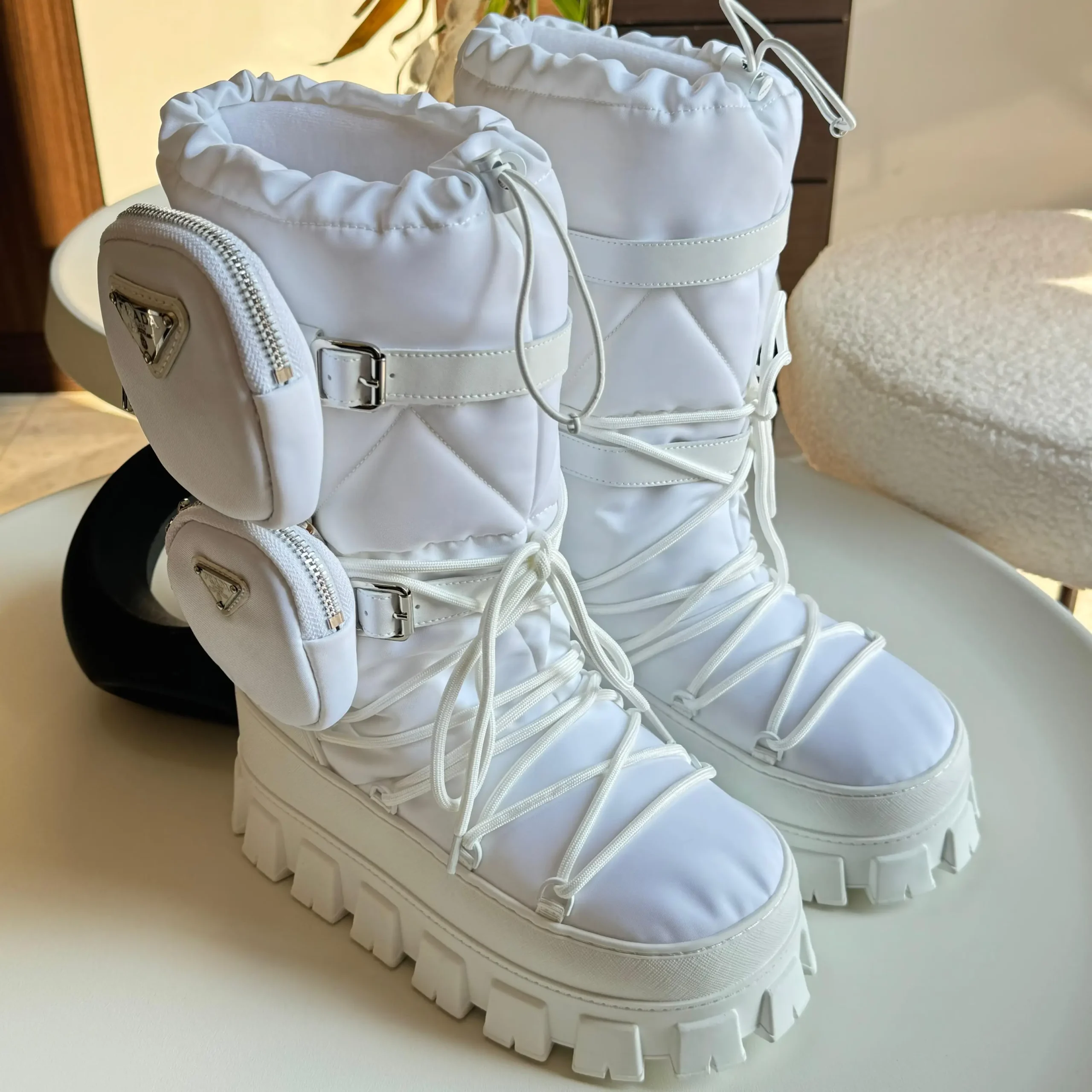 Prada Monolith Winter Boots – Nylon & Rubber Platform Boots with Side Pouches and Lace-Up Design in Dubai UAE Prada Monolith Winter Boots – Nylon & Rubber Platform Boots with Side Pouches and Lace-Up Design in Dubai UAE