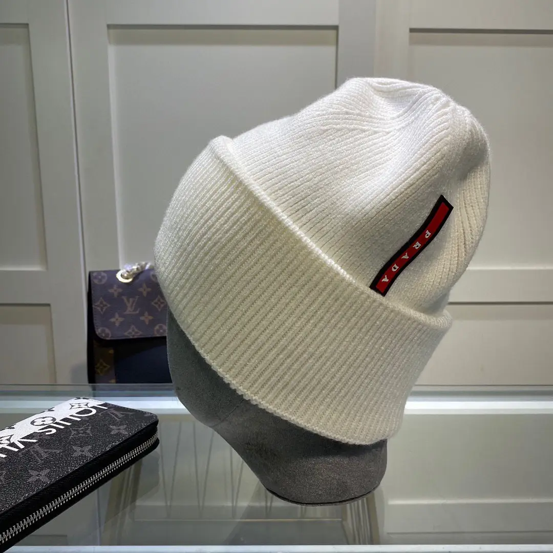 Prada White Wool-Cashmere Beanie – Shaker Knit with Iconic Triangle Logo in Dubai UAE Prada White Wool-Cashmere Beanie – Shaker Knit with Iconic Triangle Logo in Dubai UAE